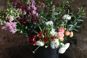 How about a bucket of mixed flowers delivered to your door?