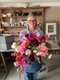 Join flower farmer florist Georgie Newbery of Common Farm Flowers for this hand tie demo using dahlias freshly cut from her own flower field. Royal Horticultural Society dahlia trials judge Georgie will share top tips for using dahlias in floristry, and will demonstrate the ‘florists’ twist’ used to make a hand tie.