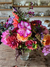 Join flower farmer florist Georgie Newbery of Common Farm Flowers for this hand tie demo using dahlias freshly cut from her own flower field. Royal Horticultural Society dahlia trials judge Georgie will share top tips for using dahlias in floristry, and will demonstrate the ‘florists’ twist’ used to make a hand tie.