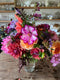 Join flower farmer florist Georgie Newbery of Common Farm Flowers for this hand tie demo using dahlias freshly cut from her own flower field. Royal Horticultural Society dahlia trials judge Georgie will share top tips for using dahlias in floristry, and will demonstrate the ‘florists’ twist’ used to make a hand tie.