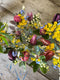 A Common Farm Flowers buttonhole is a miniature work of art, made with five little stems of gorgeous detail, bound with raffia, pinned in advance, delivered in their own individual test tube to keep it fresh as a daisy until the very last minute. Grown, cut, arranged by Somerset flower farmer & florist Georgie Newbery.